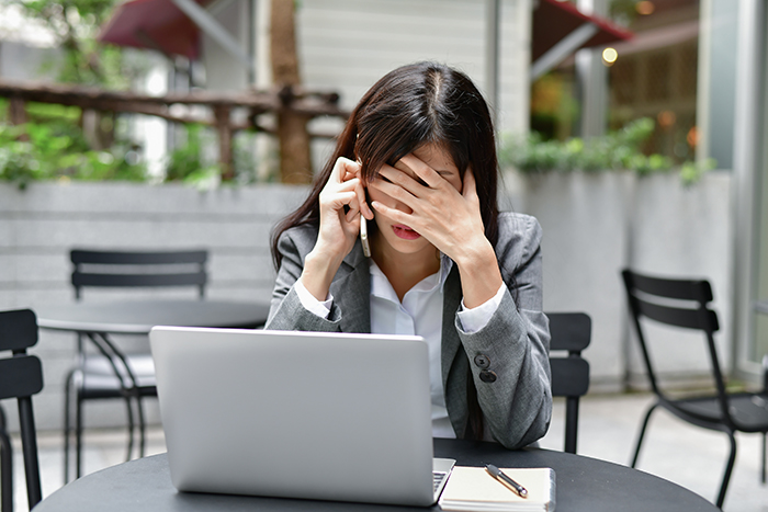 Stressed Woman Looking at Computer